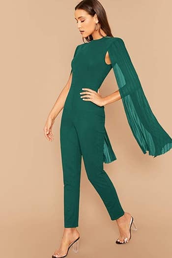 a model wearing the green jumpsuit