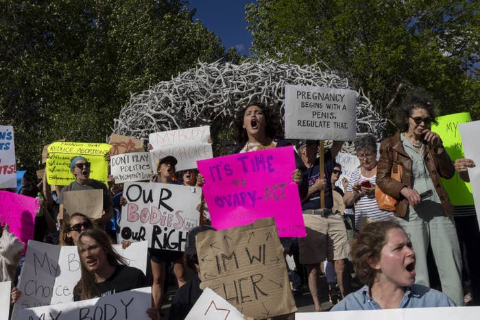 Abortion rights protesters chant slogans during a gathering to protest the Supreme Court&#x27;s decision in the Dobbs v Jackson Women&#x27;s Health case on June 24, 2022 in Jackson Hole, Wyoming.