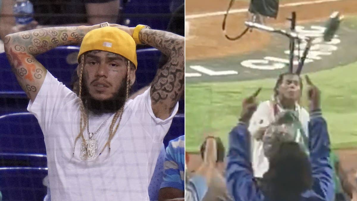 6ix9ine was reportedly kicked out of a baseball game after getting drunk and bothering fans. While at the game, video shows someone throwing a beer can at him.