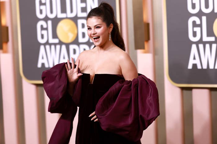 Selena waves in a strapless velvet gown at the Golden Globe Awards