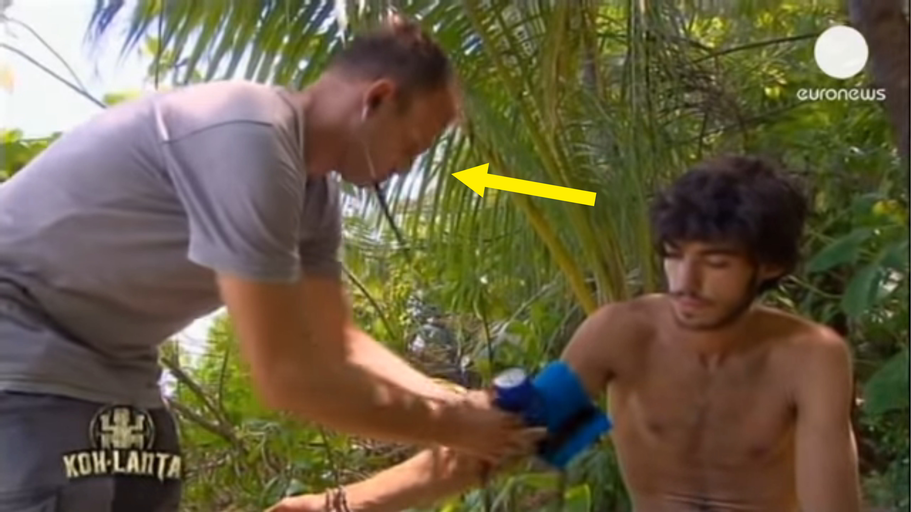 Costa checking the blood pressure on a contestant