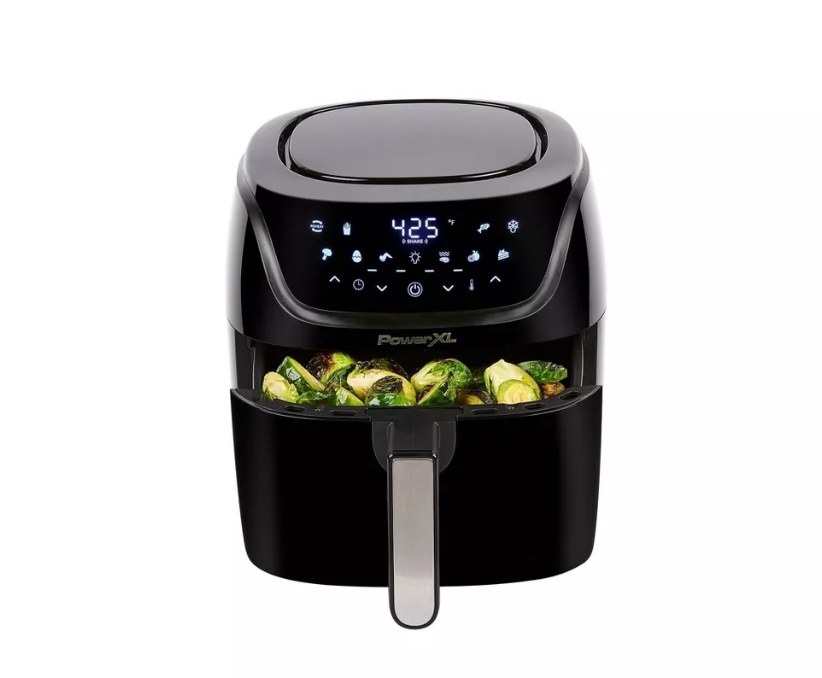 air fryer with vegetables cooking in drawer