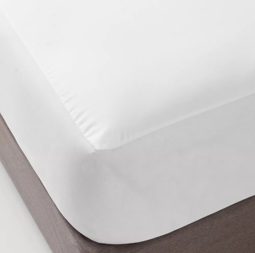 Mattress protector on bed