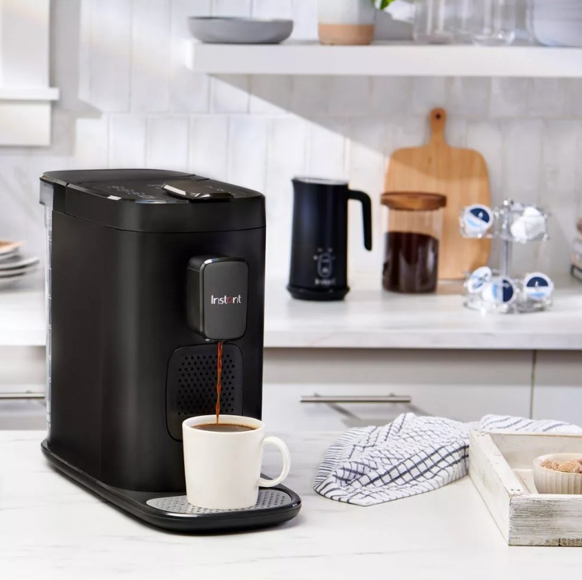 Espresso machine in use on the top of a kitchen counter