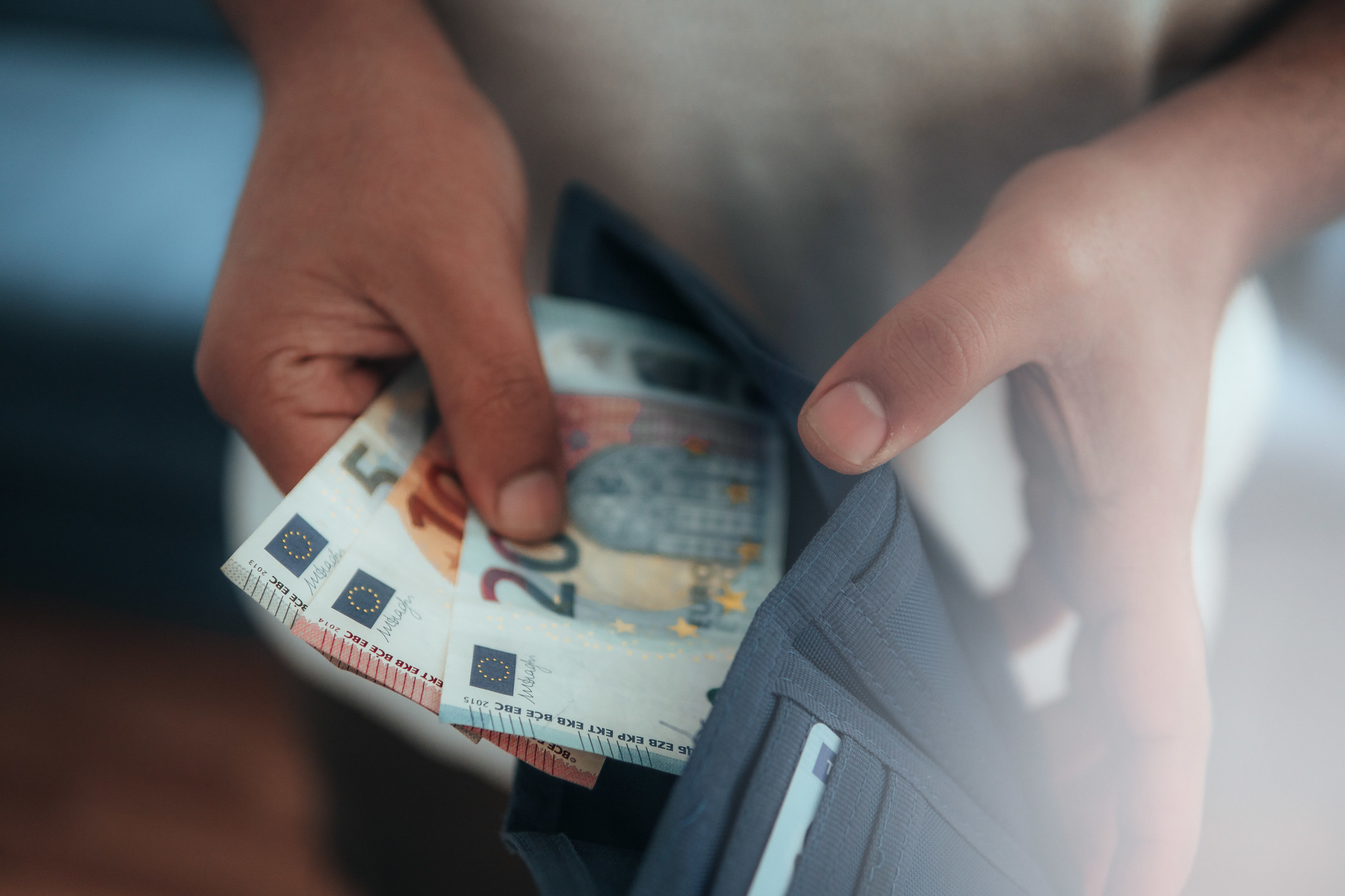 A person holding Euros.