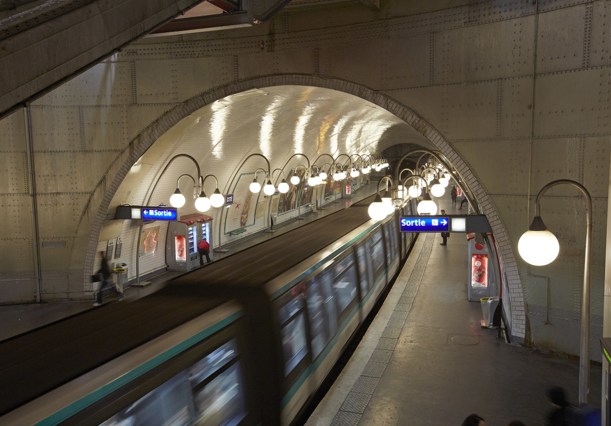 The inside of a Parisian metro station.
