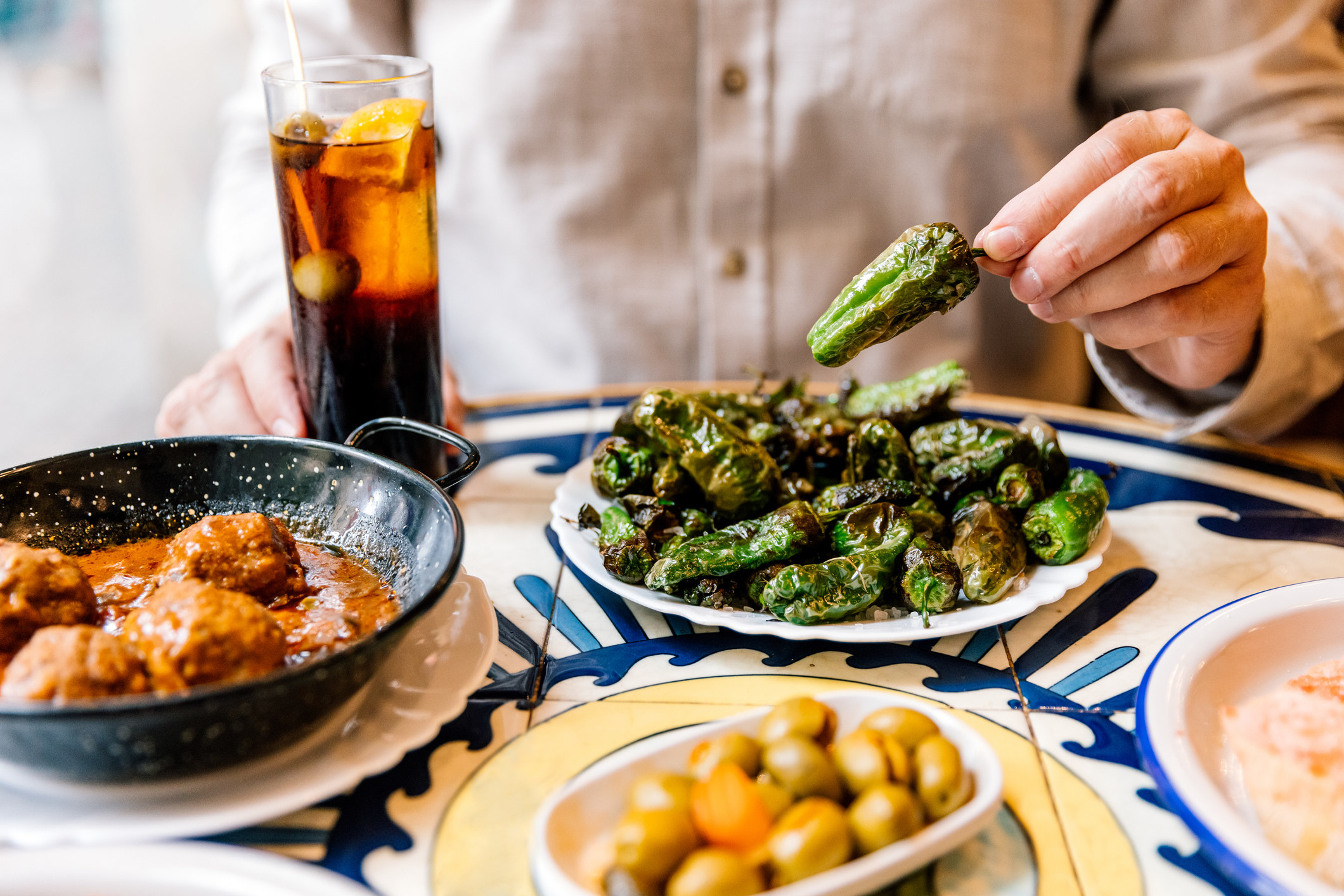 A man eating a Spanish meal.