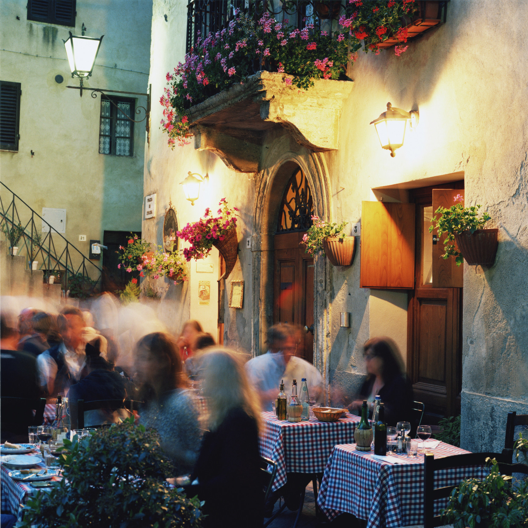 People dining outside at a quaint restaurant.
