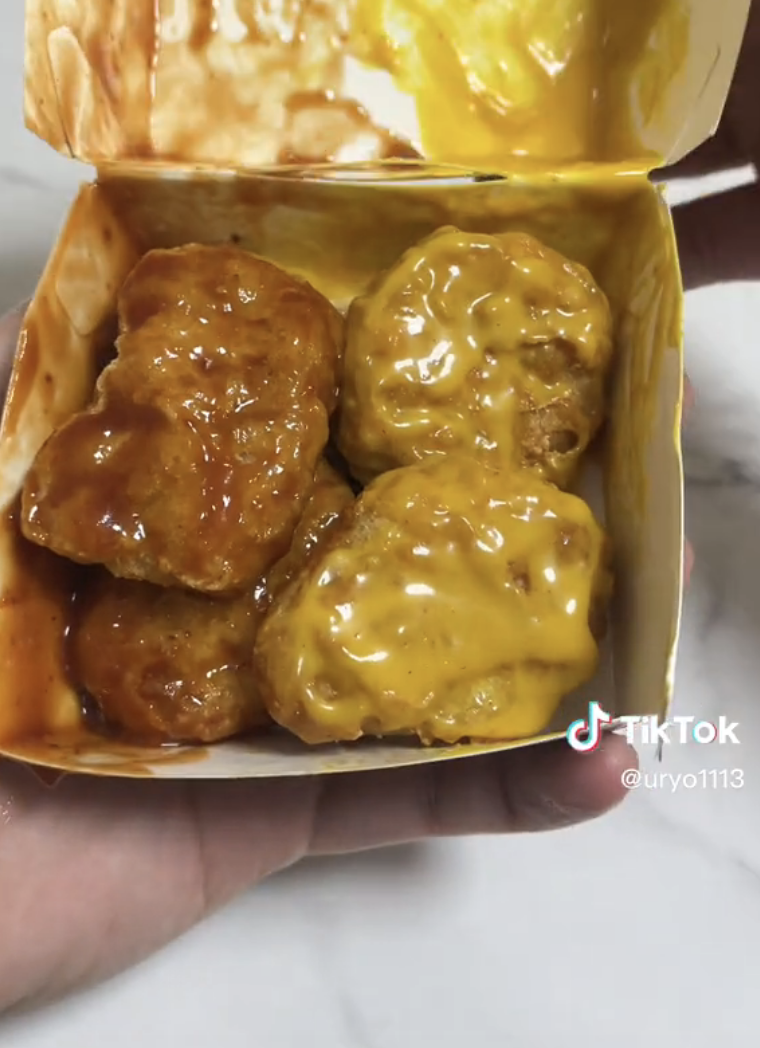 Close-up of nuggs slathered with sauce