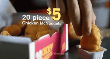 GIF of person dipping a nugget into sauce with &quot;20 pice $5 Chicken McNuggets&quot; text