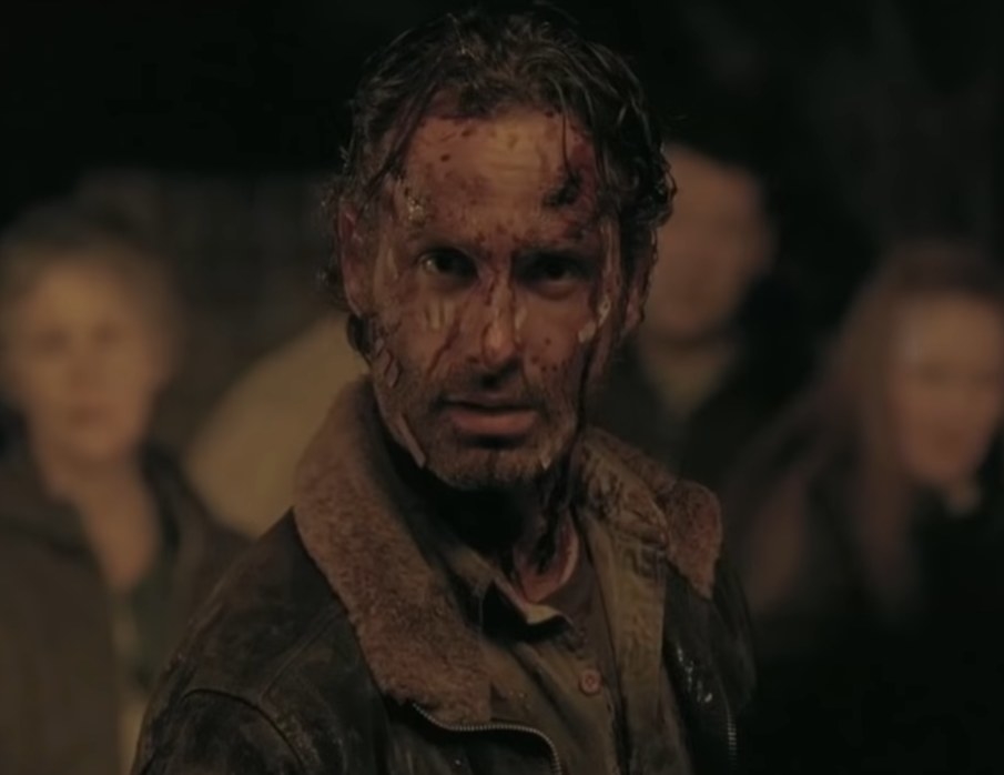 Rick Grimes covered in blood and bandages looking at someone surprised