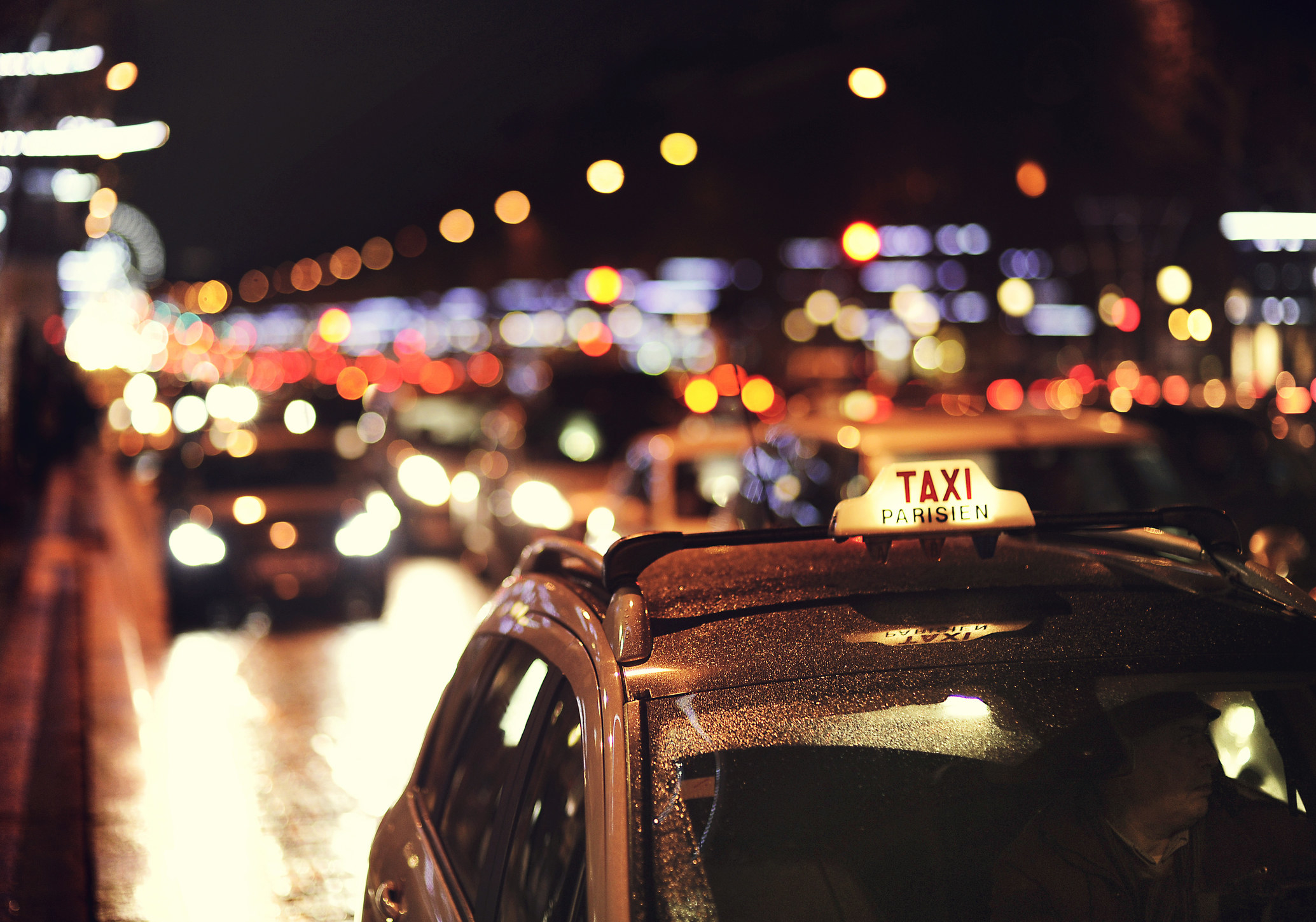 A Parisian taxi at night.