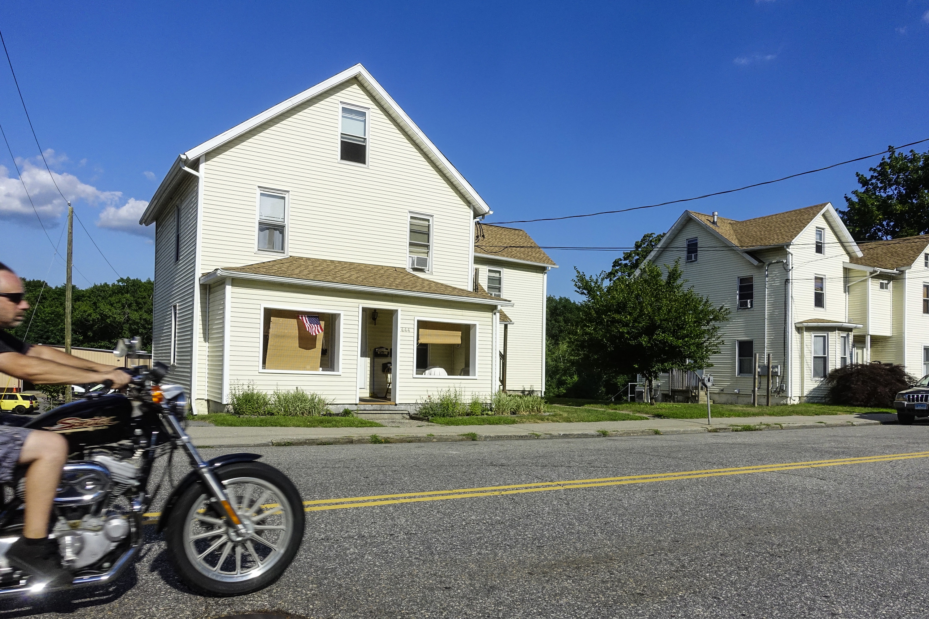 Torrington, Wyoming motorcyclist riding down a residential block