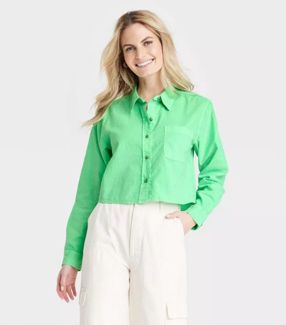 model wearing green cropped button up