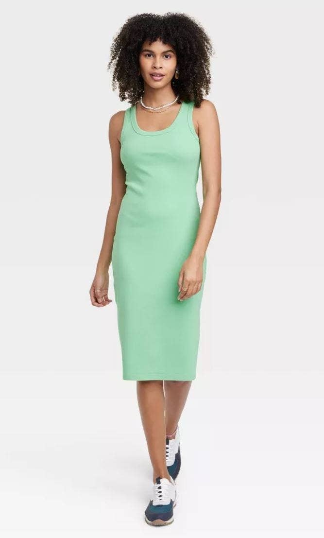 model wearing mint green knit dress