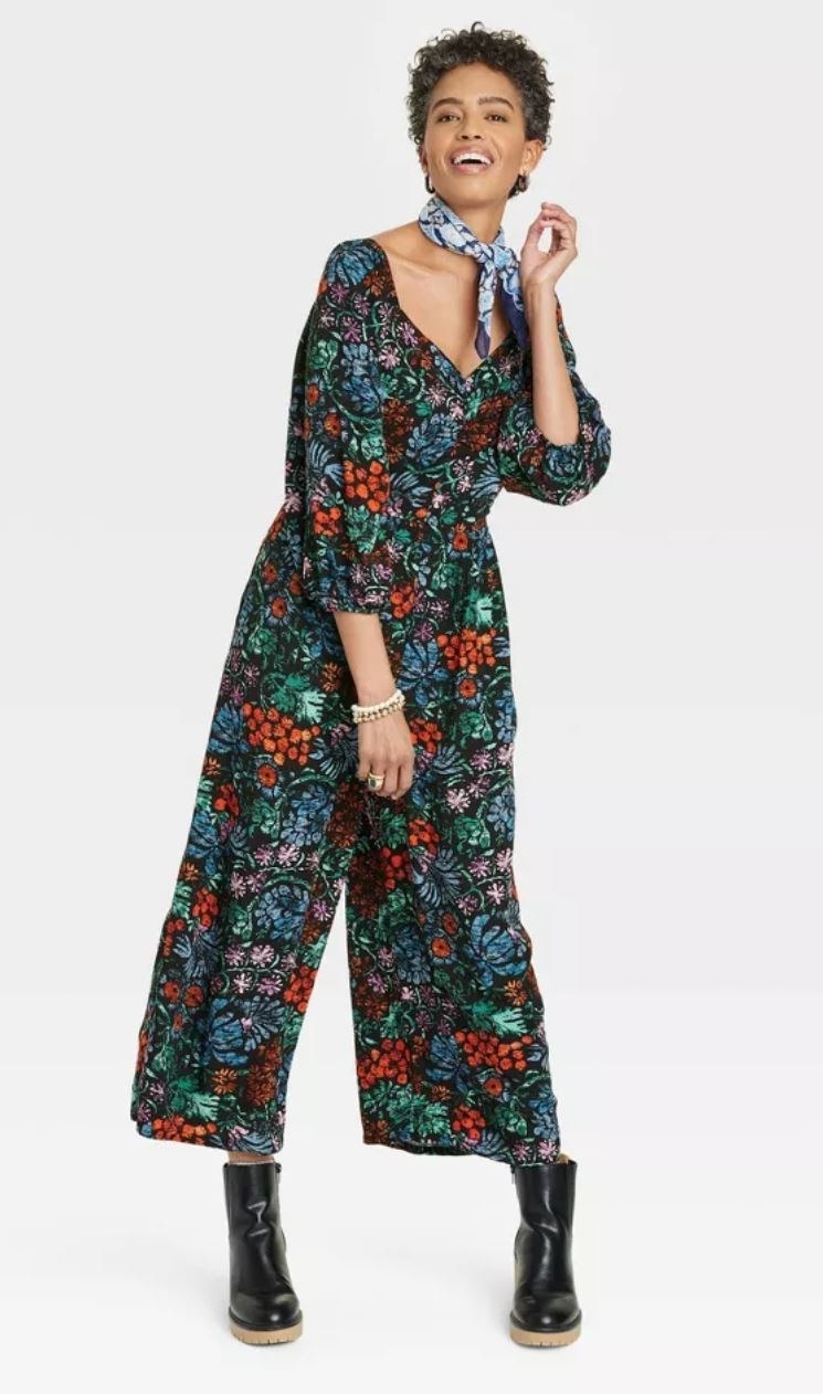 model wearing floral jumpsuit