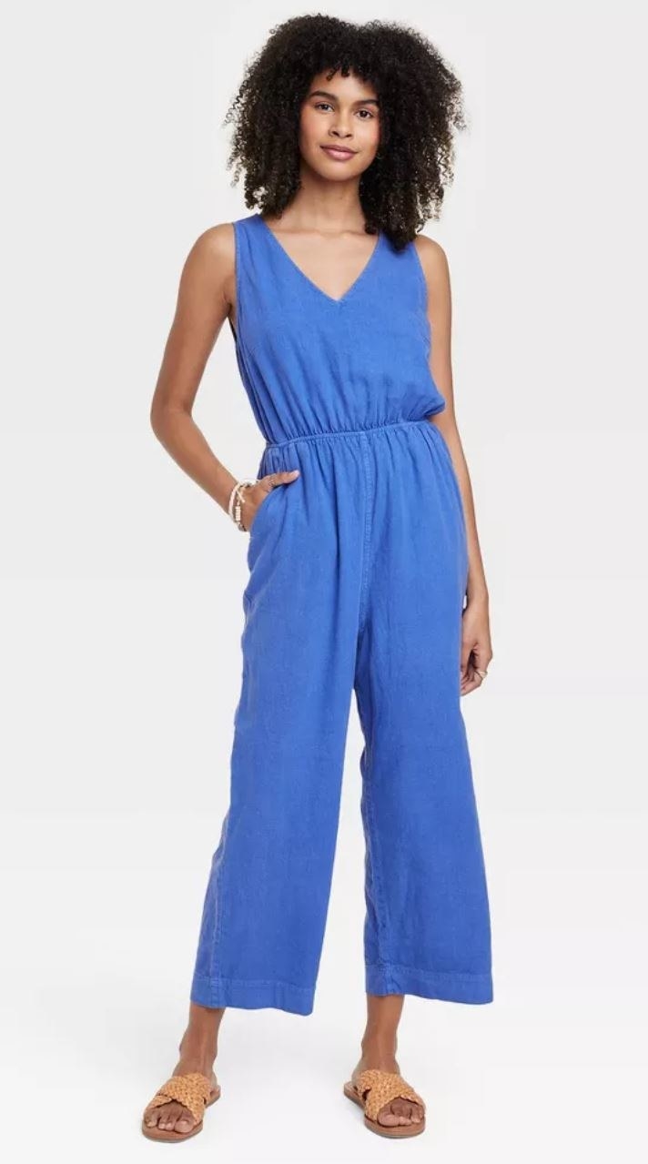 model wearing blue jumpsuit