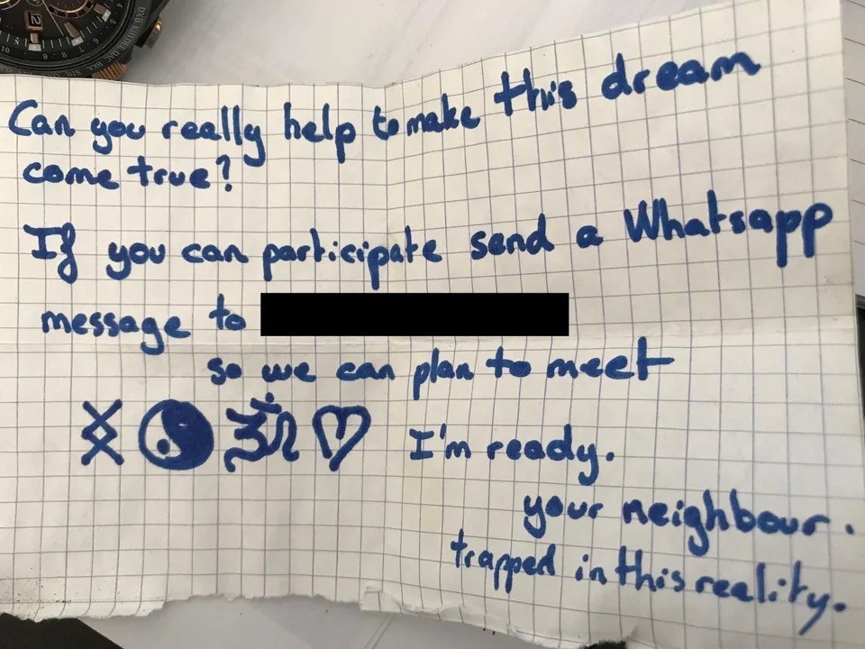 The note reads: can you really help to make this dream come true? If you can participate send a Whatsapp message to (blank) so we can meet, I&#x27;m ready, your neighbor, trapped in this reality