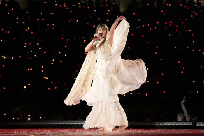 Taylor singing while twirling her flowing dress