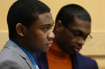 Shooting suspects Trayvon Newsome, left, and Michael Boatwright enter the courtroom