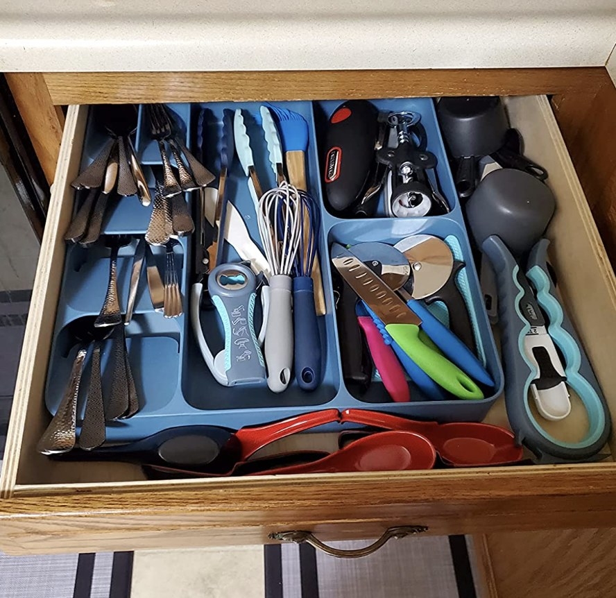The product in a drawer with utensils in it