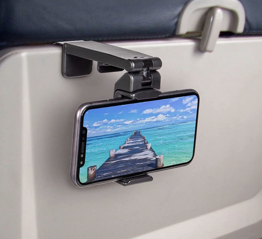 The product displaying a phone on the back of a plane seat