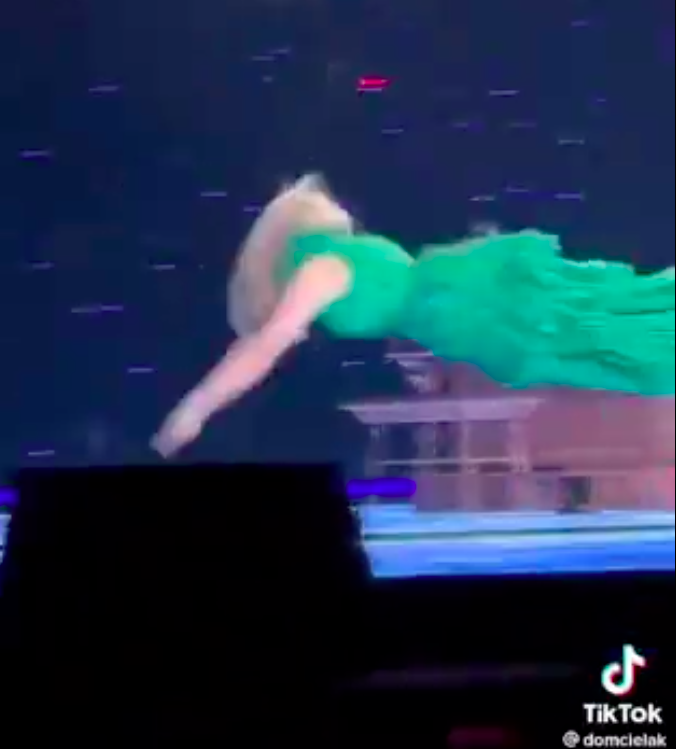 Taylor diving into water onstage