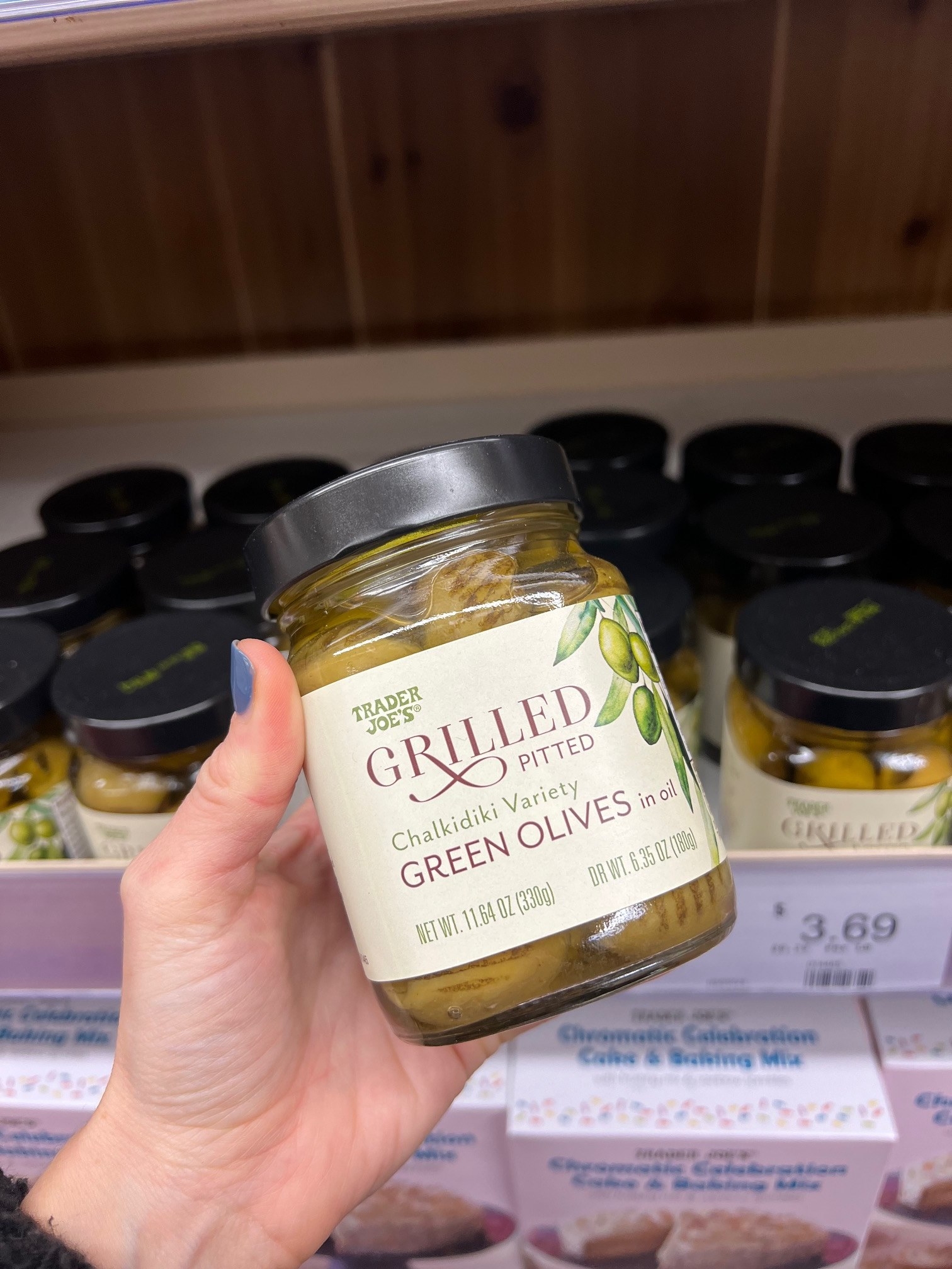 A jar of Grilled Pitted Green Olives In Oil