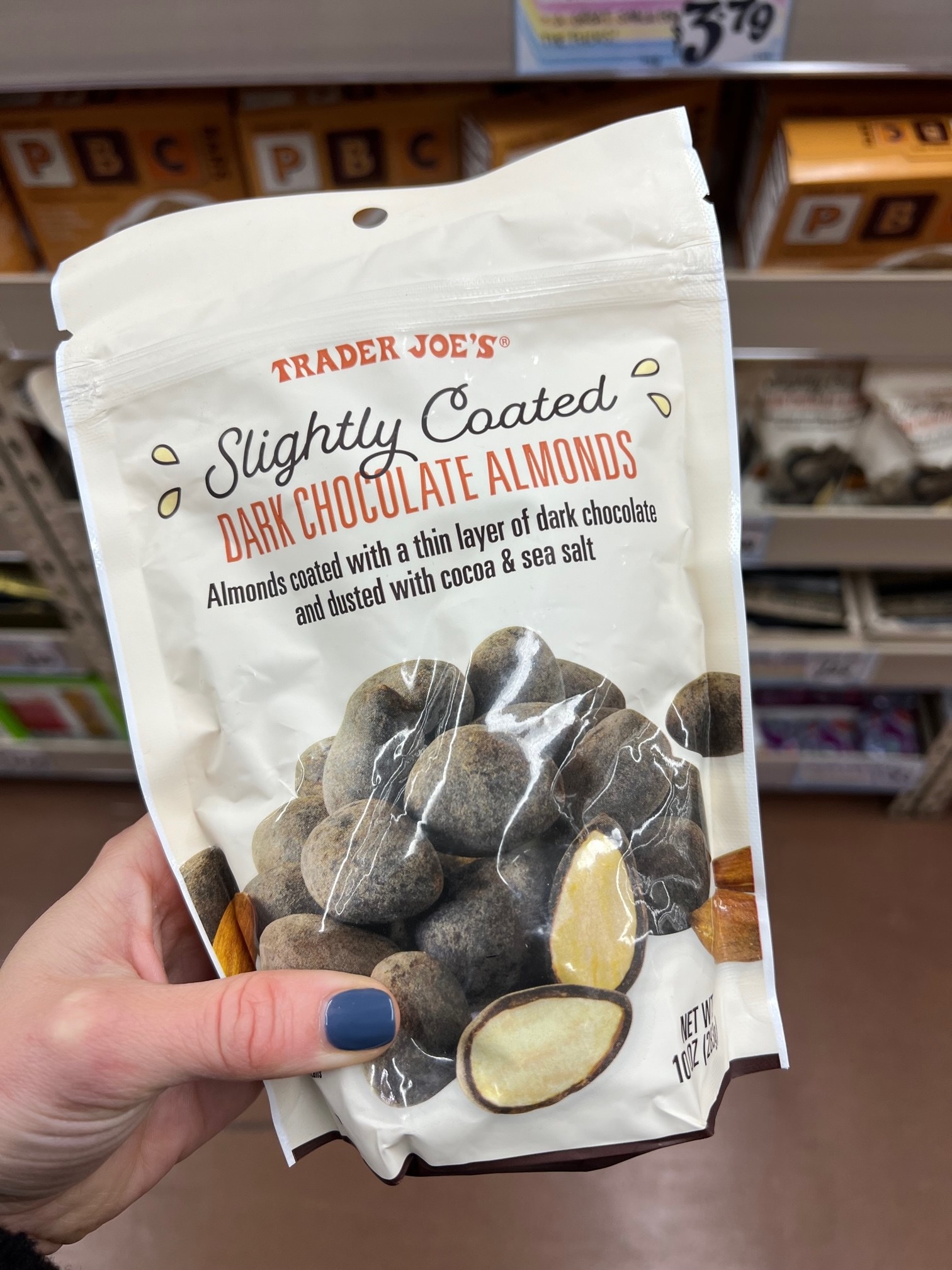 A bag of Slightly Coated Dark Chocolate Almonds: &quot;almonds coated with a thin layer of dark chocolate and dusted with cocoa &amp;amp; sea salt&quot;