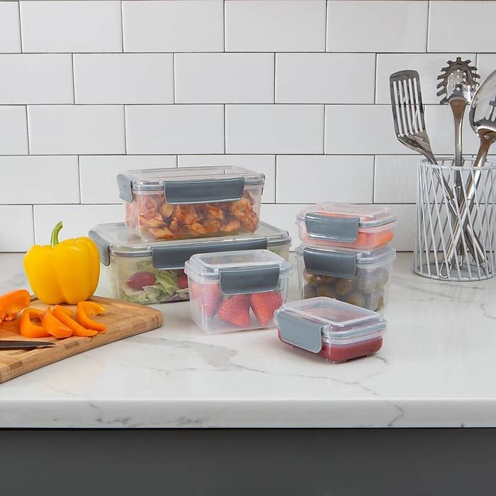 The food containers with food inside them on a kitchen counter