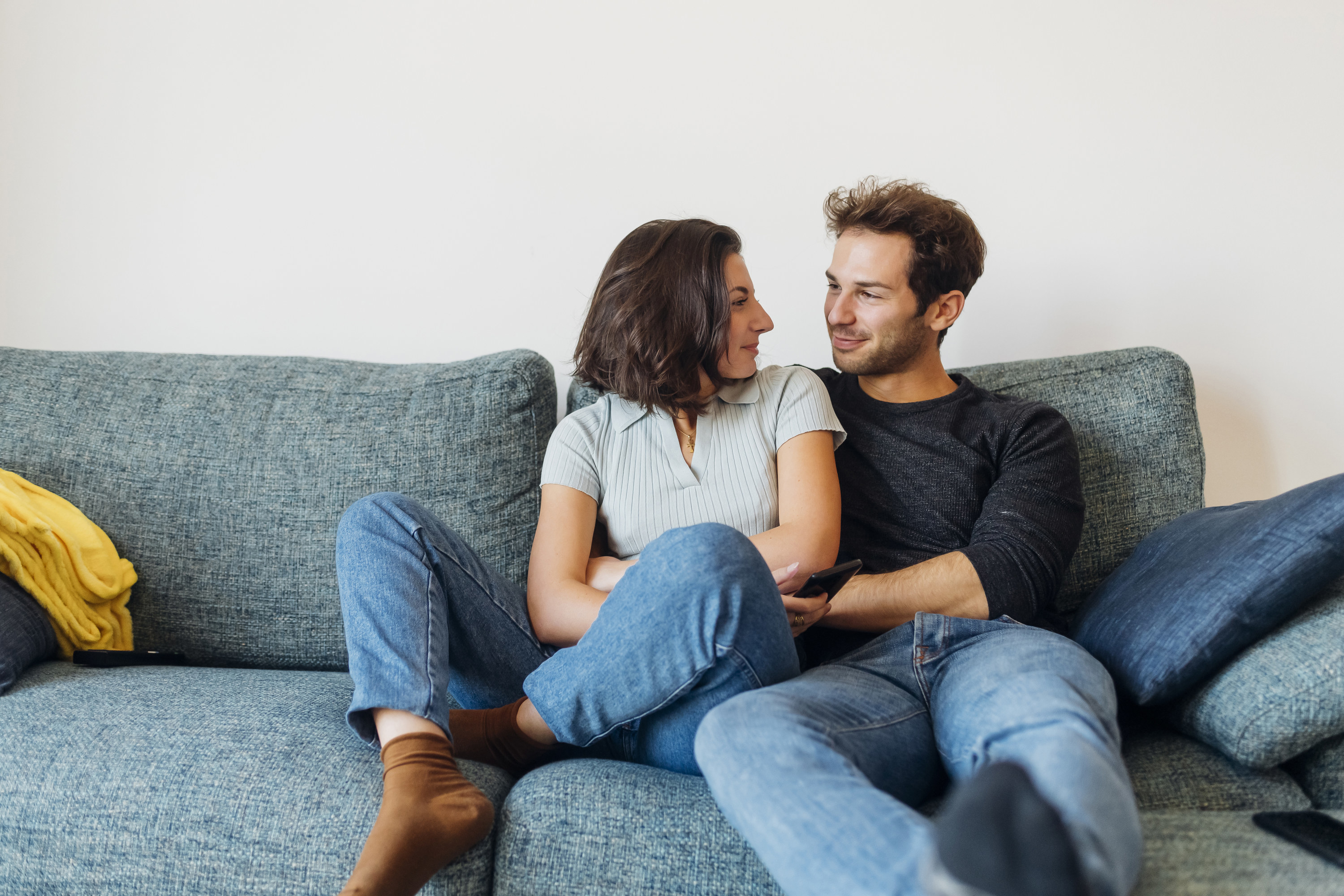 couple hugging on the couch