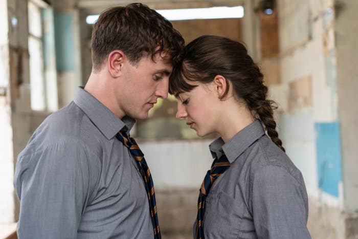 A man and woman with their foreheads touching each other