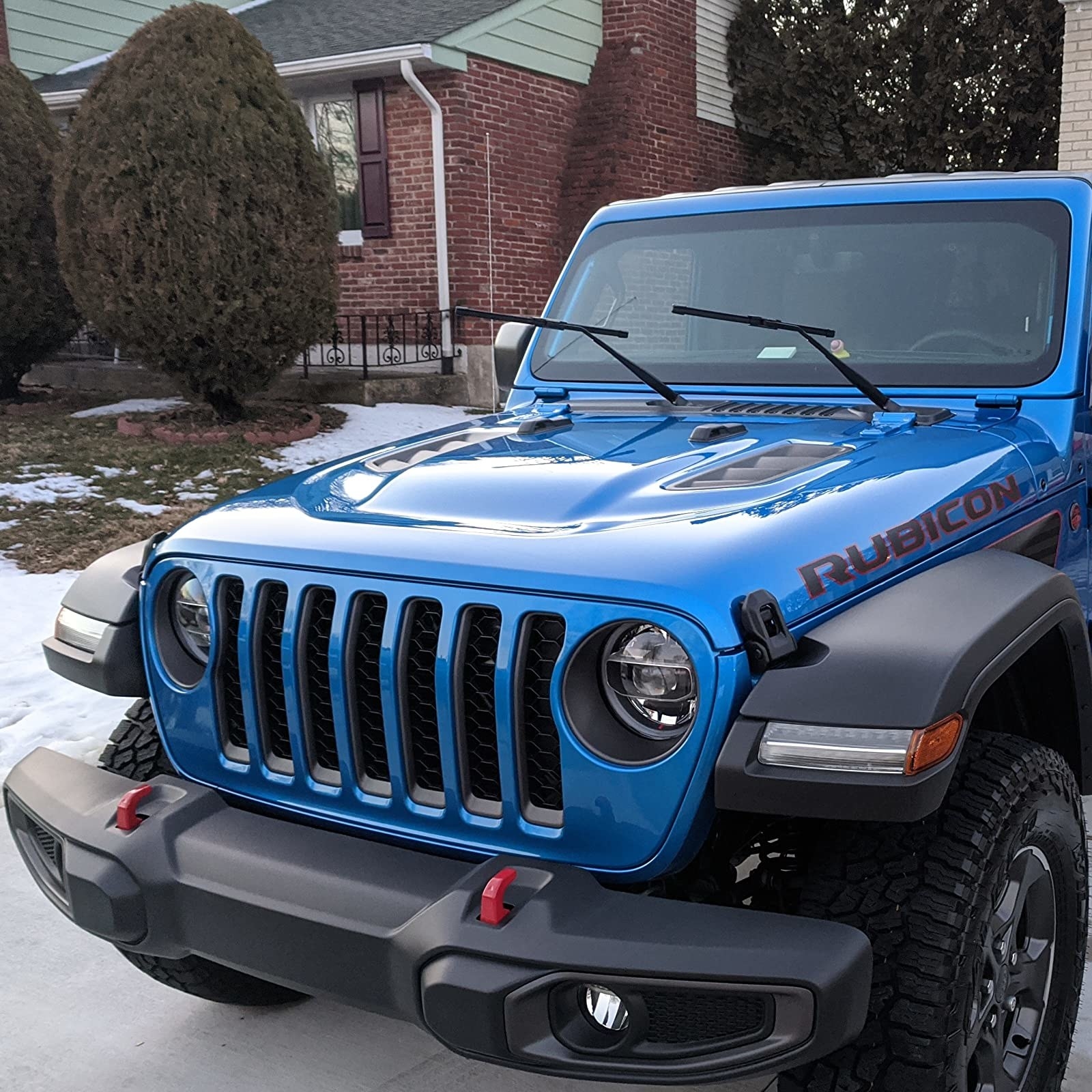 a shiny blue Jeep