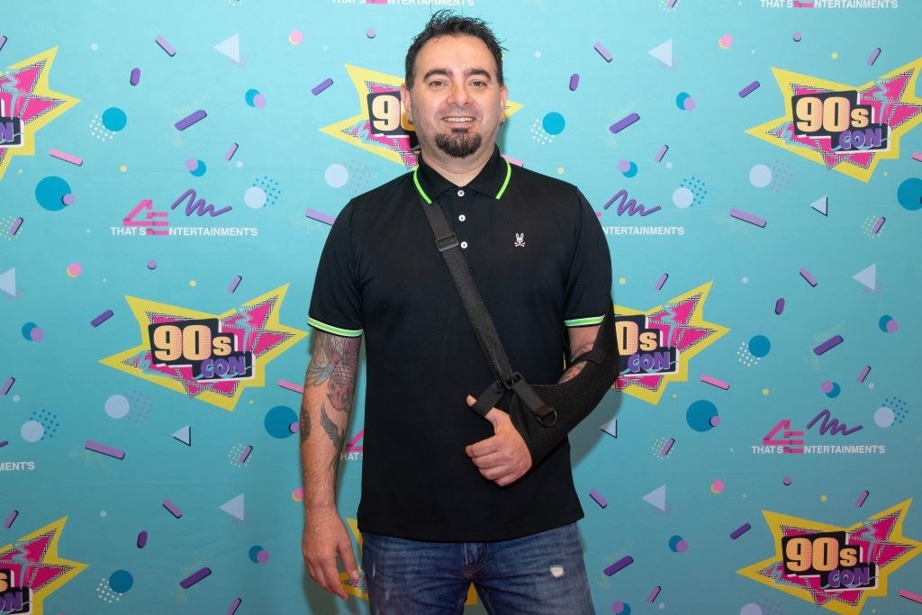 Chris on the red carpet at the 4 Entertainment 90s Con 2023. Chris has his left arm in a sling