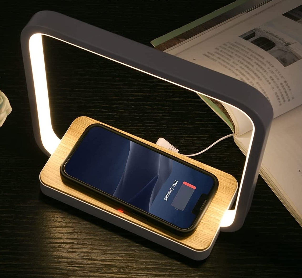 the lamp with a phone charging on it