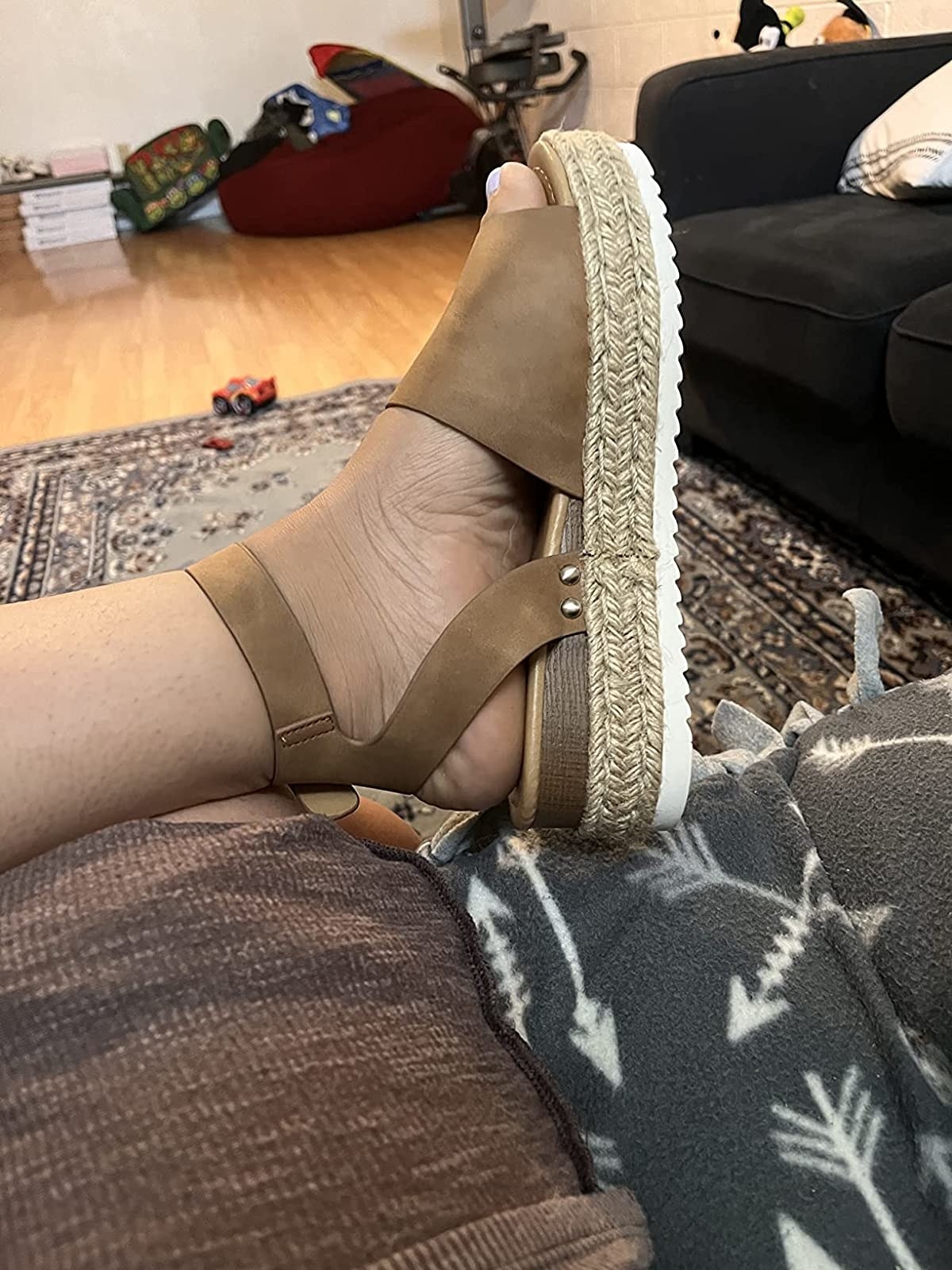 Reviewer wearing brown espadrille sandals