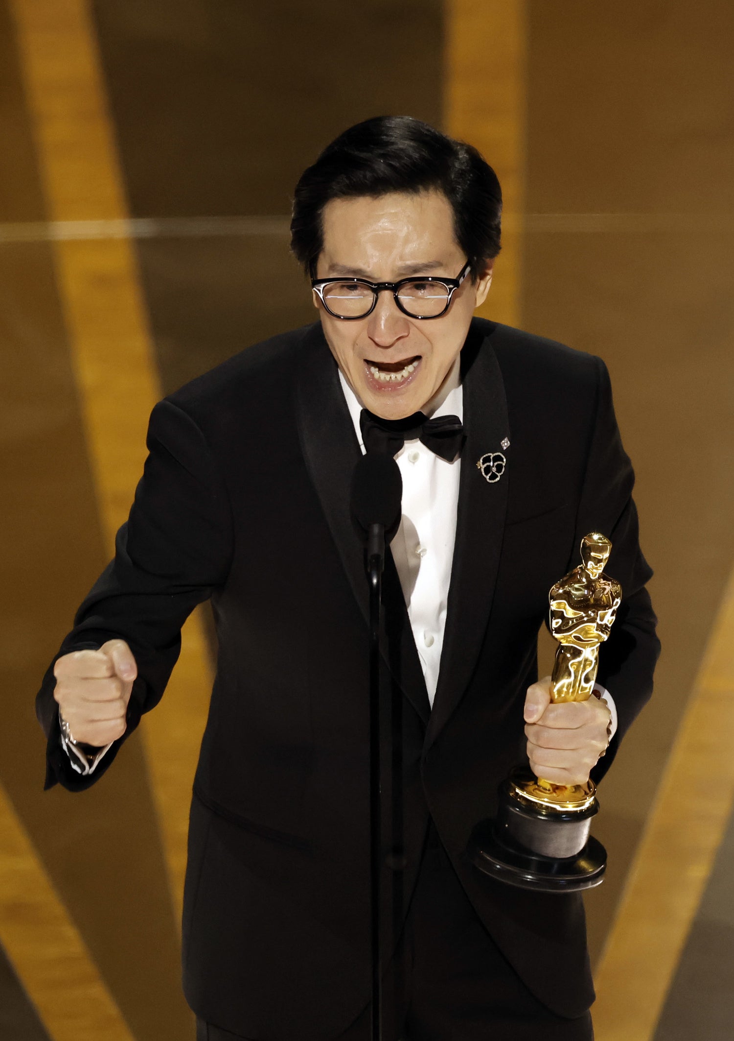 Ke Huy crying as he accepts the Best Supporting Actor award &quot;Everything Everywhere All at Once&quot; onstage during the 95th Annual Academy Awards