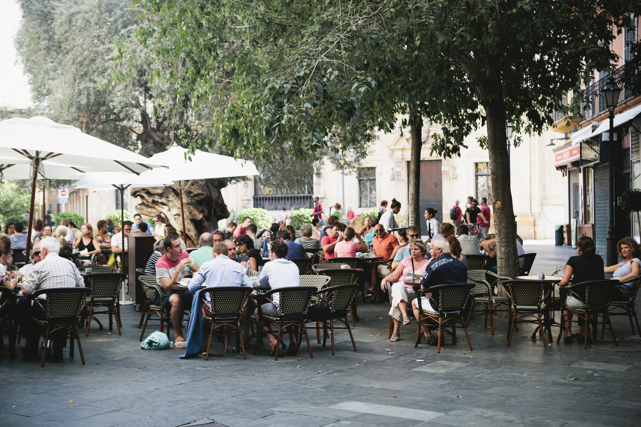 People dining outdoors in a plaza