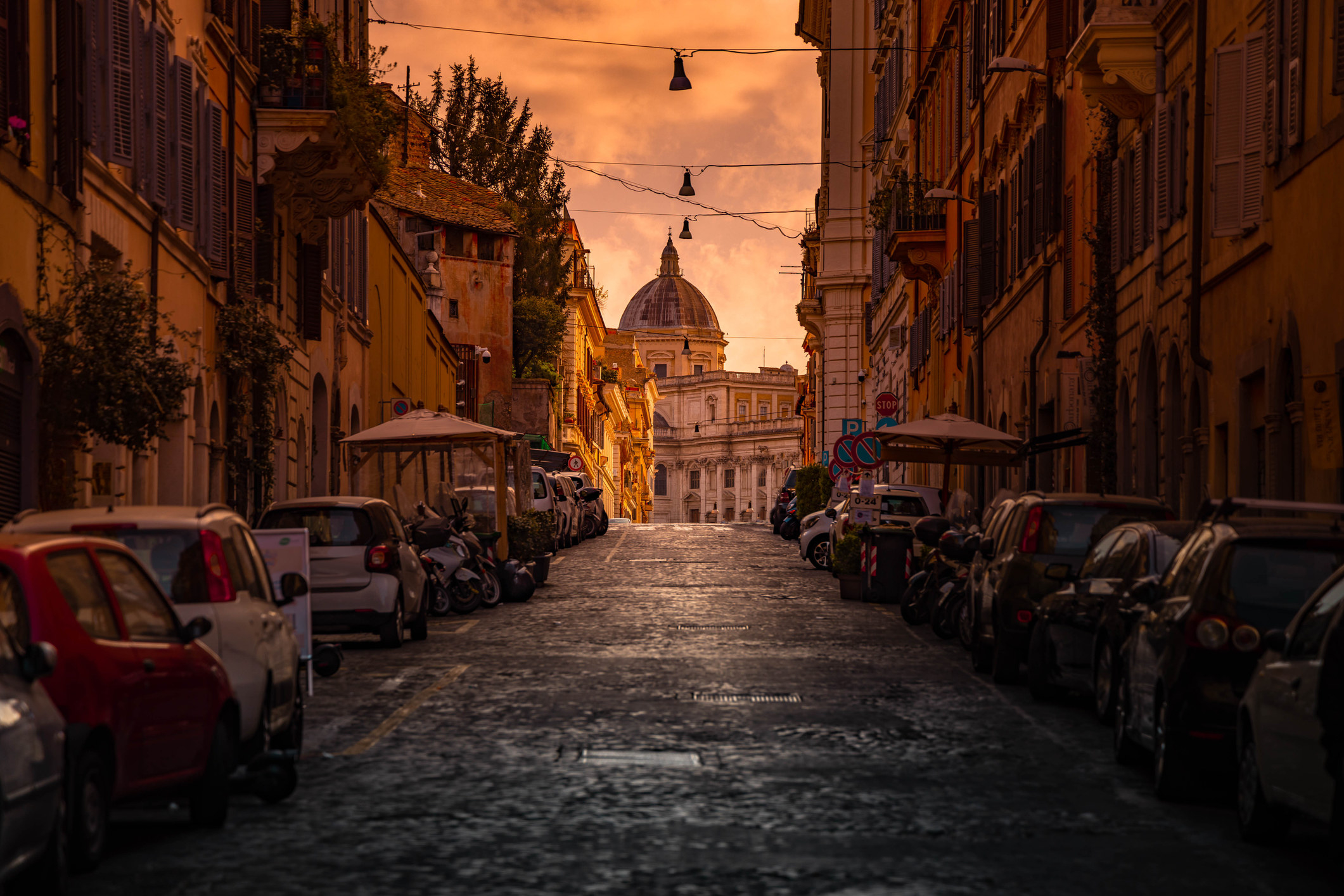 Dramatic light in the streets of Rome with church dome