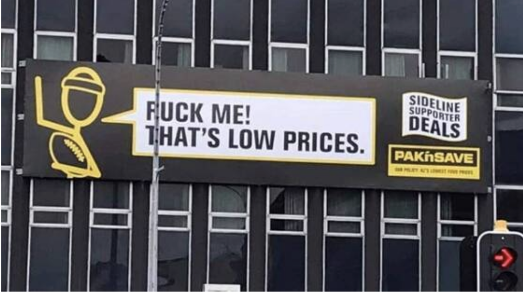 a pole is blocking the sign so it looks like it says &quot;fuck me! that&#x27;s low prices&quot;