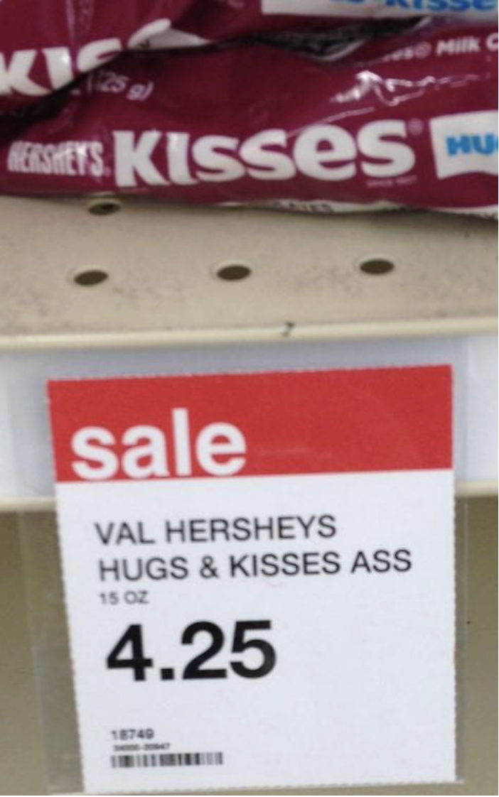 sign that says &quot;Hershey&#x27;s hugs and kisses ass&quot;