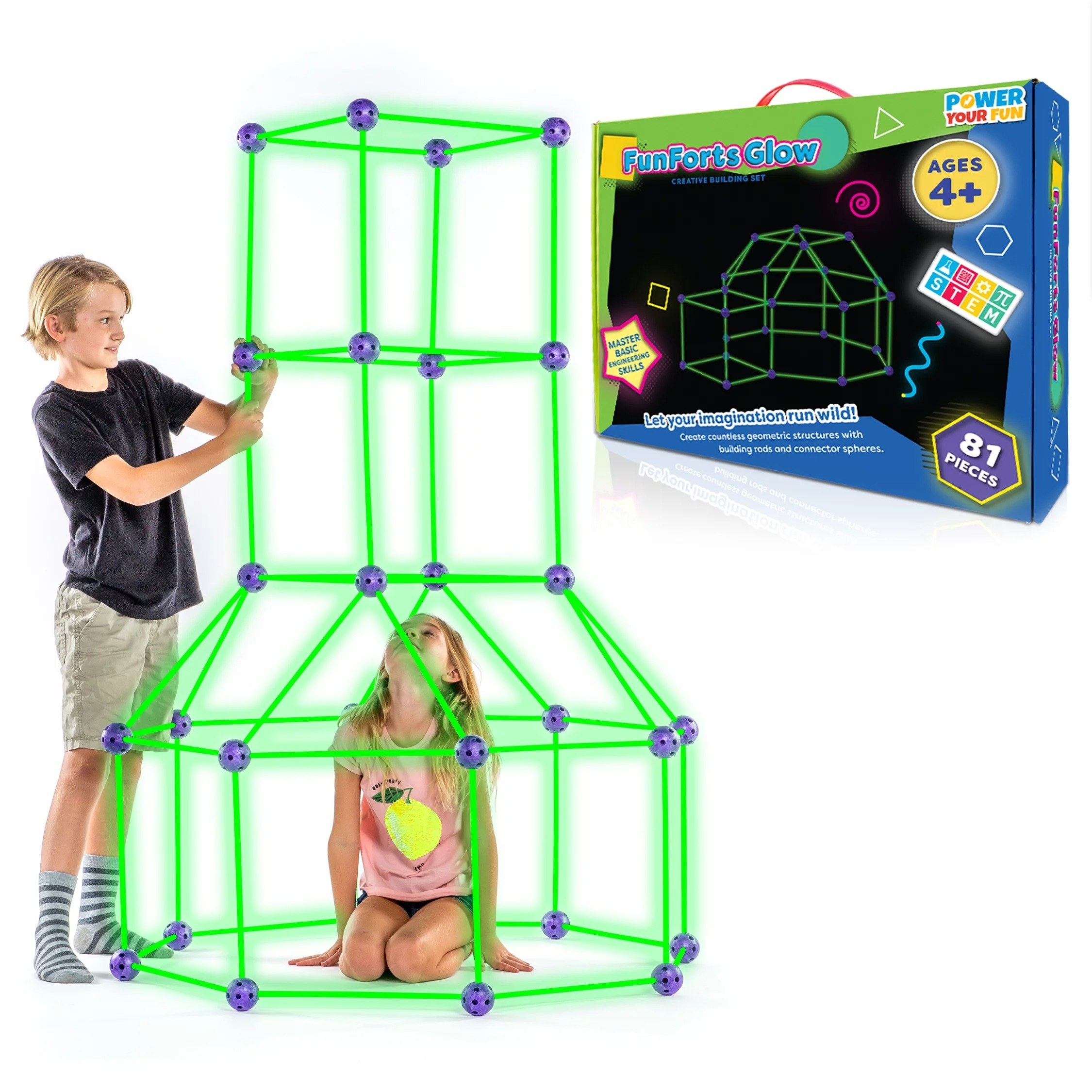 Two kids building the glow in the dark fort