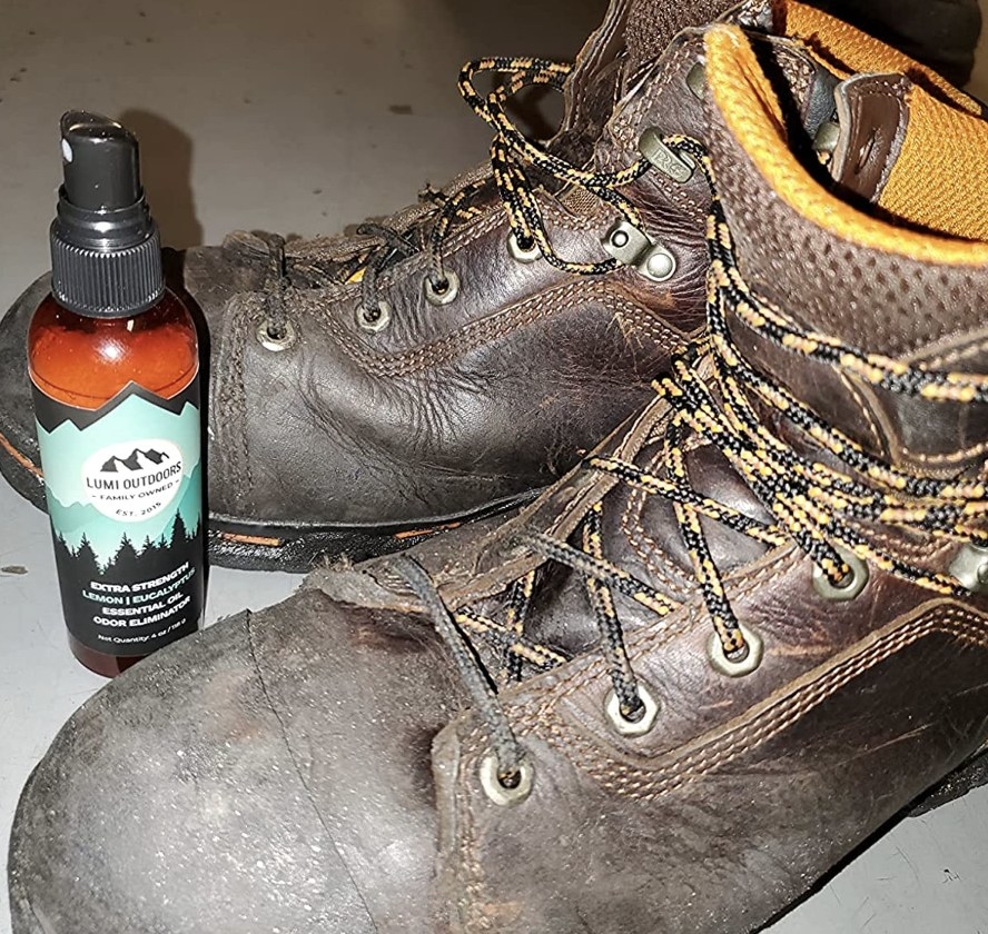 reviewer photo showing the spray next to a pair of boots