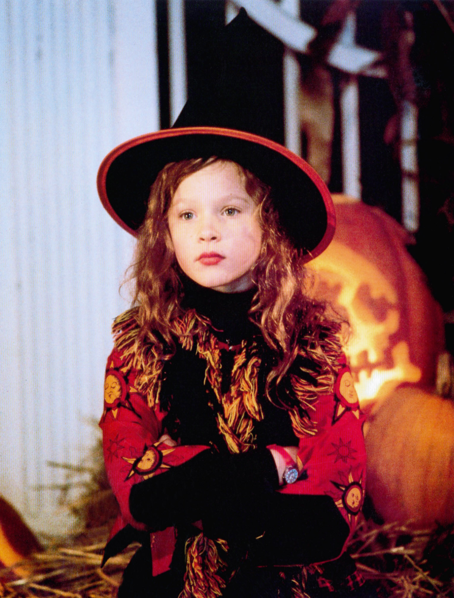 A young Thora wearing a witch&#x27;s hat and has her arms crossed in a scene from Hocus Pocus