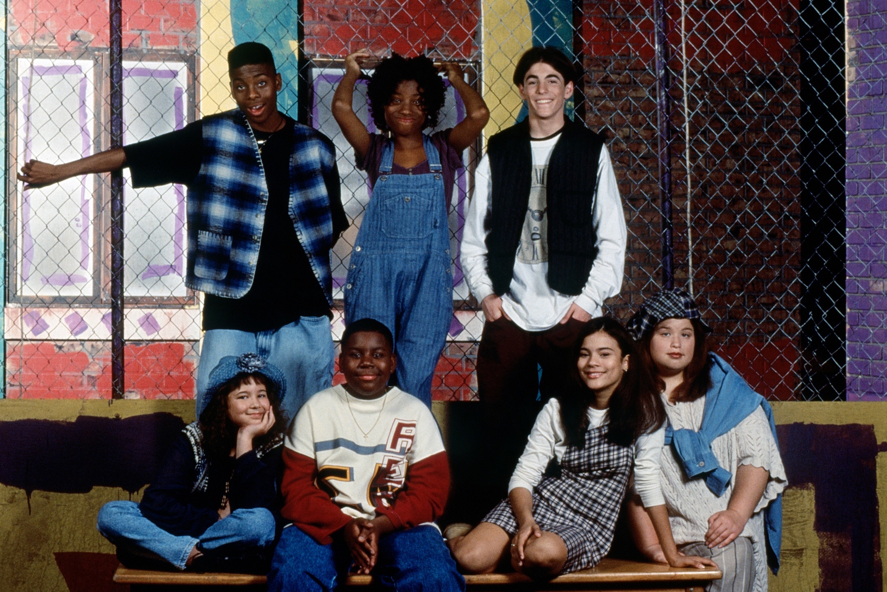 A throwback of the All That cast smiling for a group photo on set