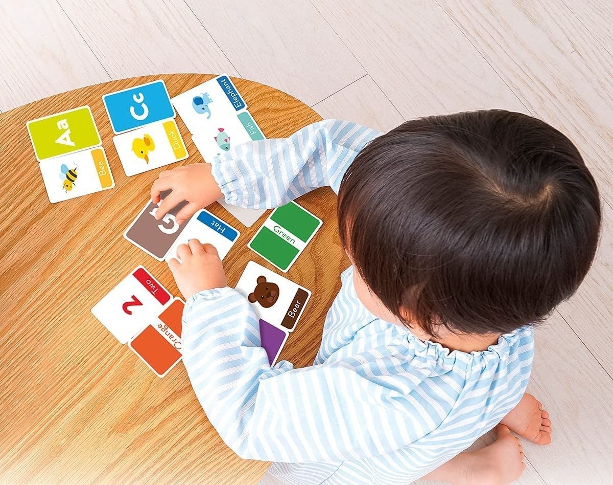 kid playing with cards