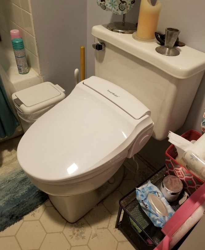 a reviewer image of the bidet toilet seat