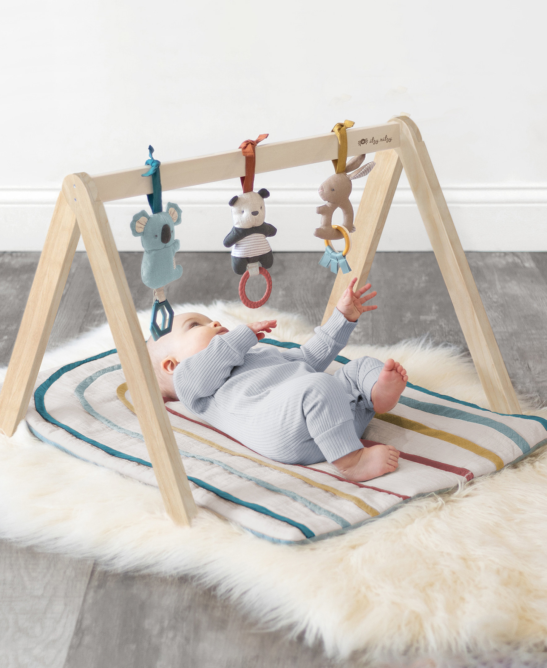 Baby playing with activity gym