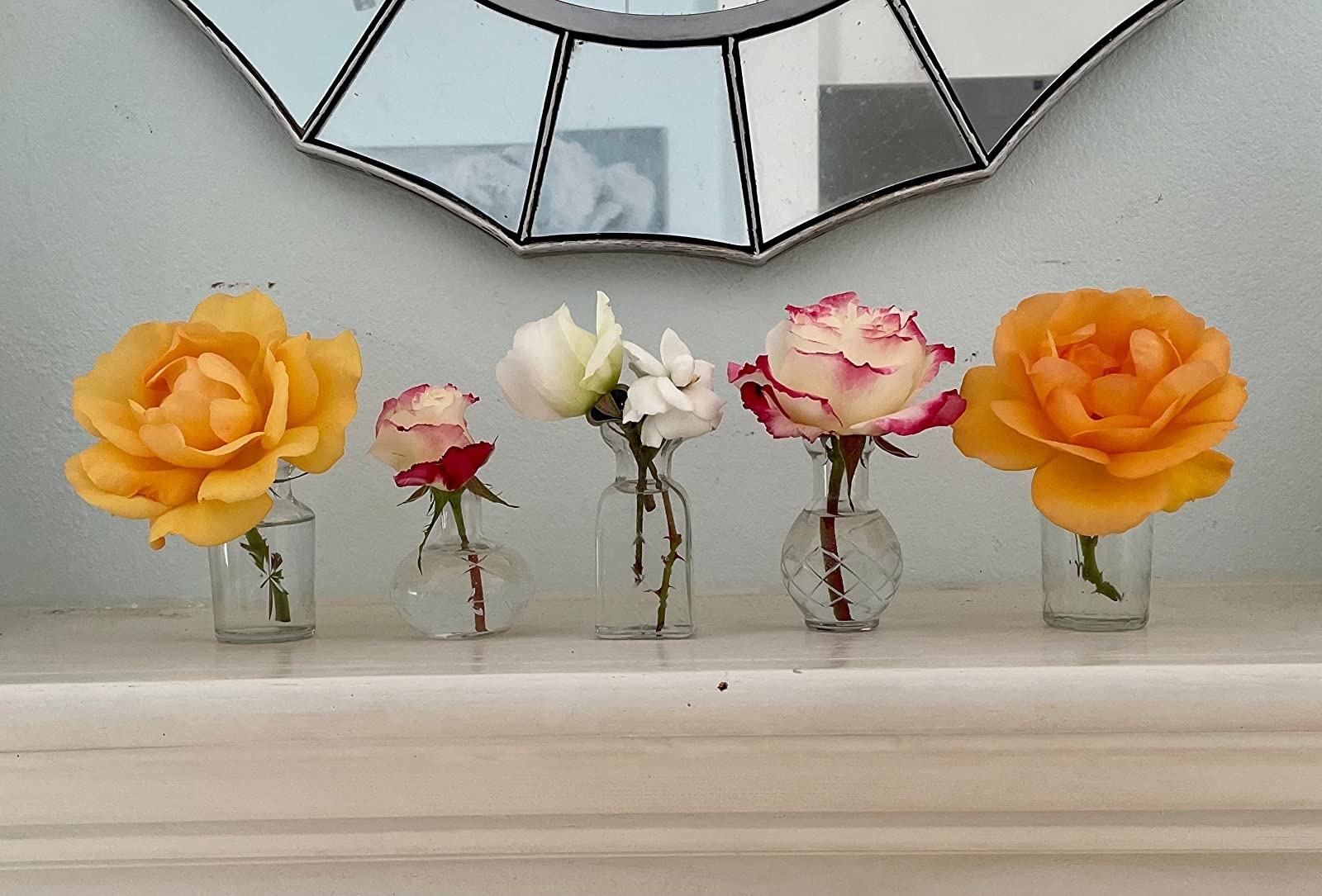 Reviewer&#x27;s set of vases holding various stems of roses