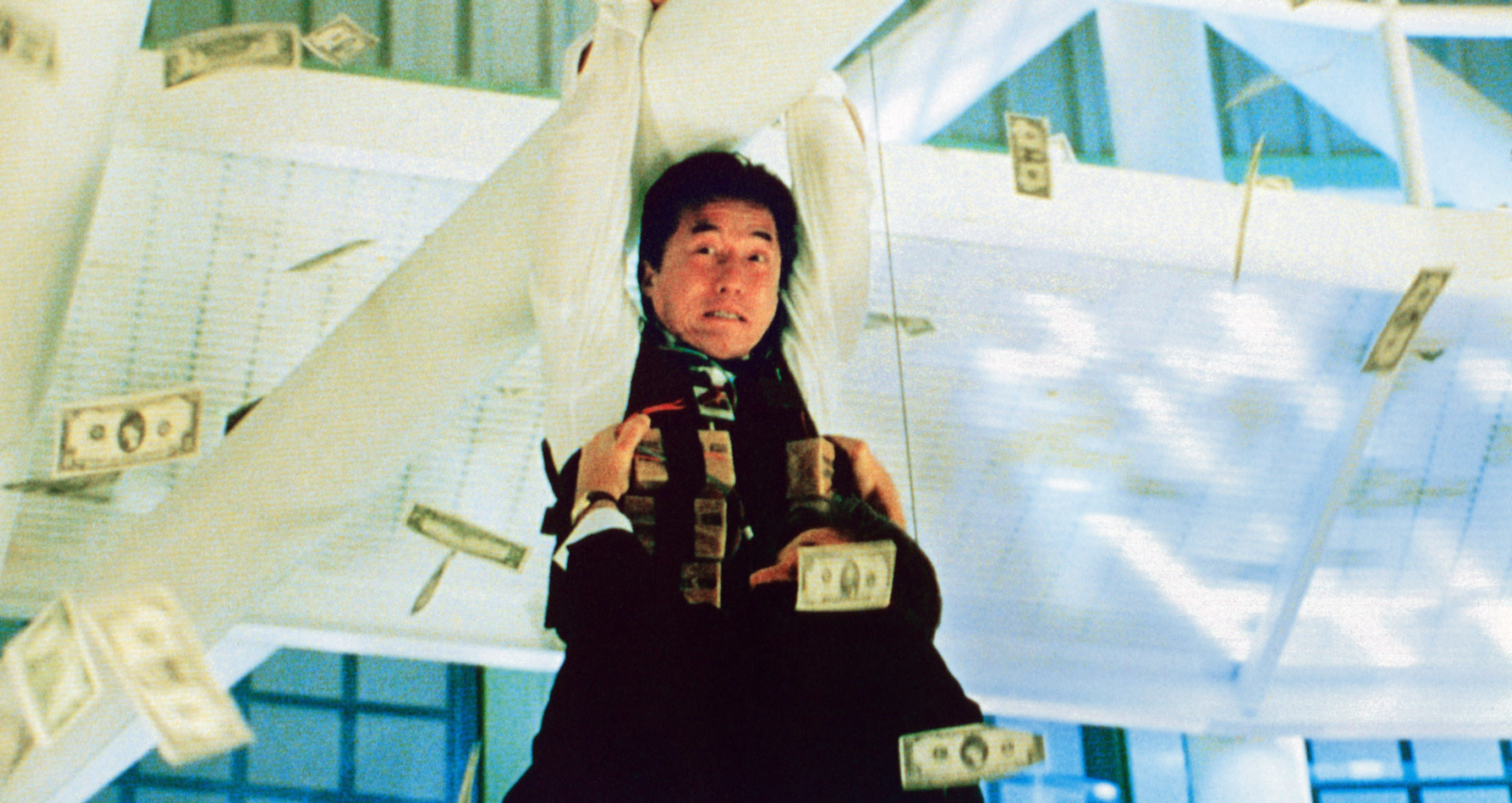 jackie hanging from a pole in the movie
